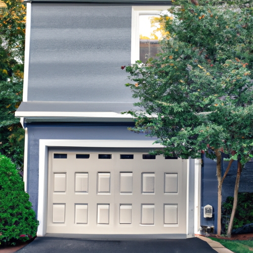 Suburban Wellesley home with a raised-panel residential garage door, trimmed shrubs and driveway, late afternoon light.